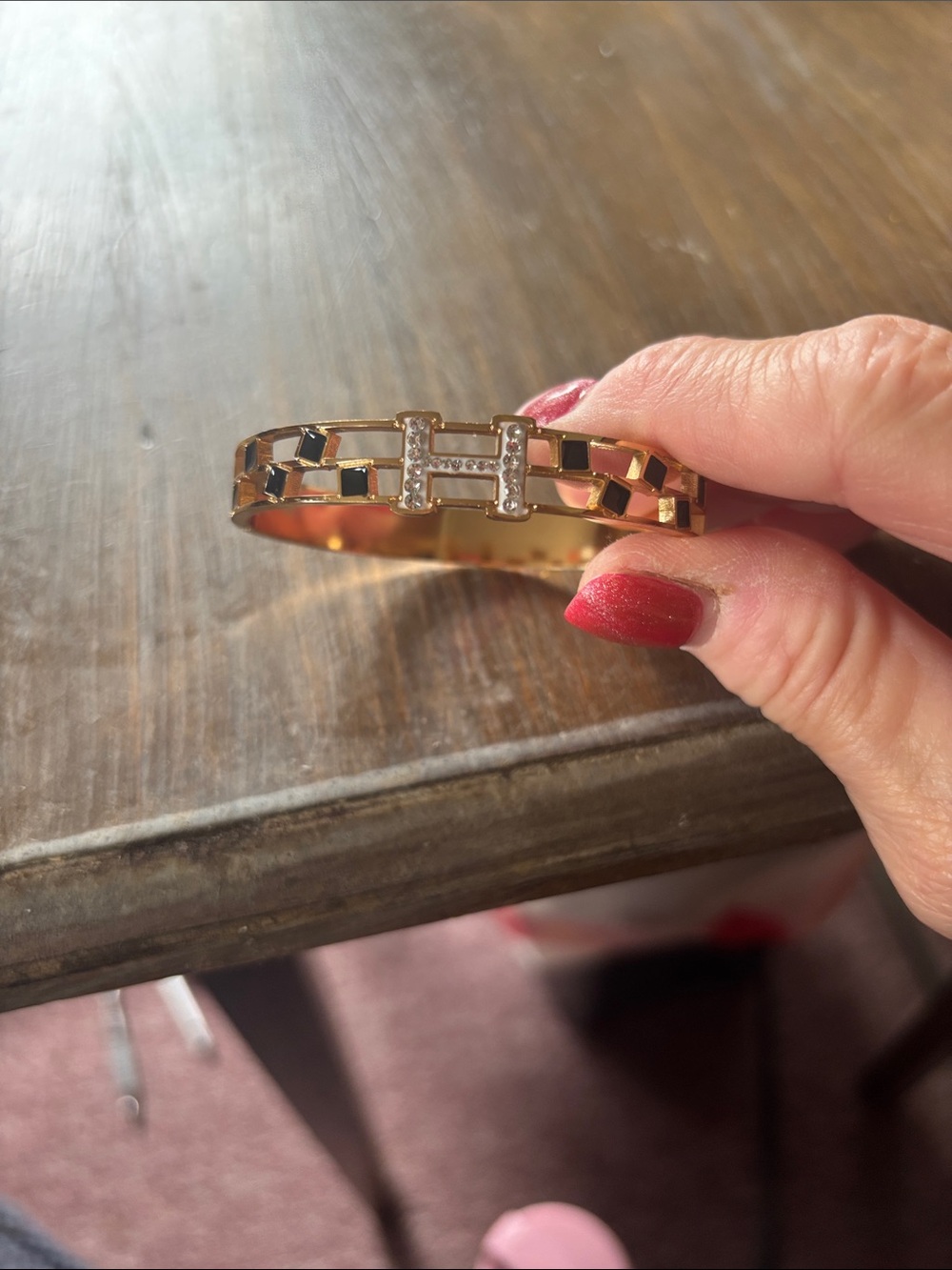 Gold-Tone H Logo Cuff Bracelet with Black Enamel and Crystals